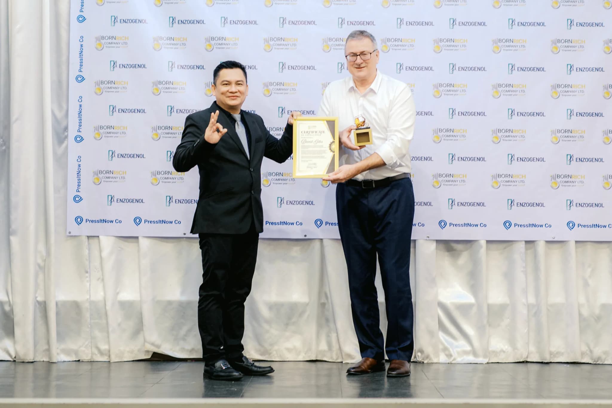 Bornrich Company and PressItNow Co. celebrate a partnership award at the Growth and Innovation event