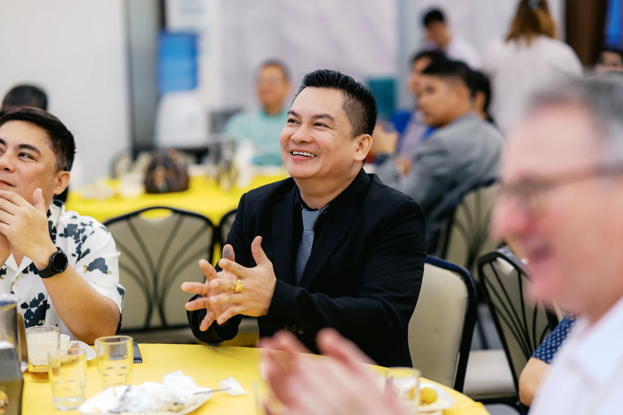 Guest applauding at the Celebration of Growth and Innovation