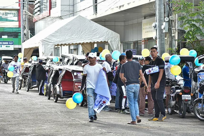 Tricycles decorated with balloons lining the street during the Pindot San Jose launch