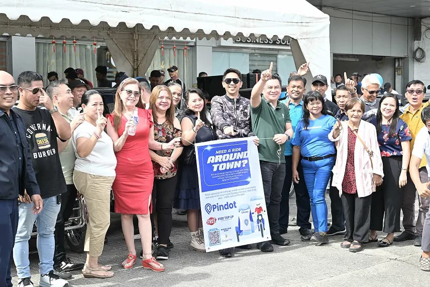 Ribbon-cutting and banner moment at the Grand Launching of Pindot App in San Jose, Nueva Ecija